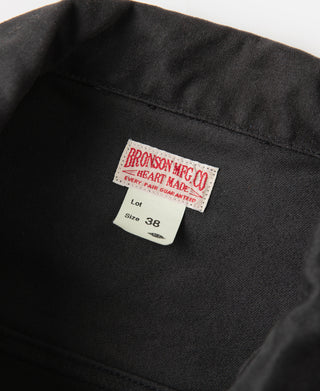 Black moleskin Cossack jacket neck label and inner collar seam close-up