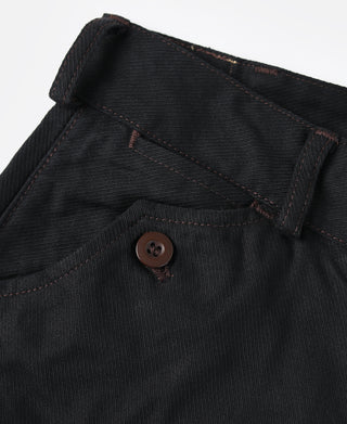 Black breeches waistband with buttoned inner facing and stitched seams.