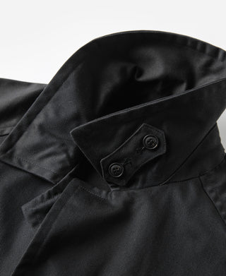 Black all-weather trench coat cuff with double-button tab and strap detail