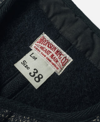 Wool vest size label 38 on dark salt-and-pepper fabric