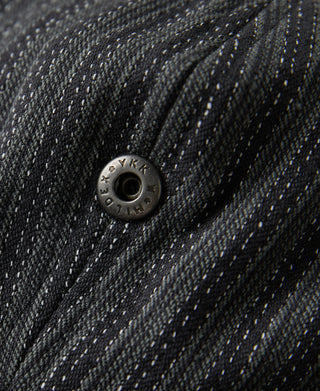 Black and gray newsboy cap with metal eyelet and stitched stripe texture.