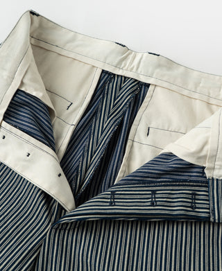 Cream striped work pants, open pocket showing navy stripe lining and stitching
