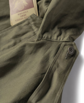 Olive parka sleeve with snap cuff and side button tab detail