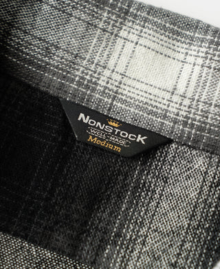Woven fabric label on ombre check sports shirt interior
