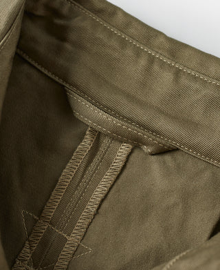 Khaki green paratrooper jacket close-up of reinforced seam and stitched panel