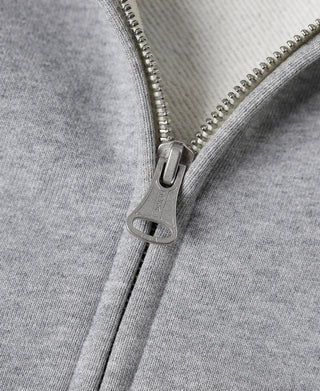 Gray full-zip hoodie zipper with metal pull tab and stitched placket