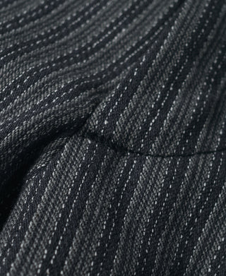 Close-up of dark fabric with thin gray pinstripes