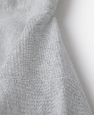 Gray hoodie sleeve with ribbed cuff and soft heathered knit texture