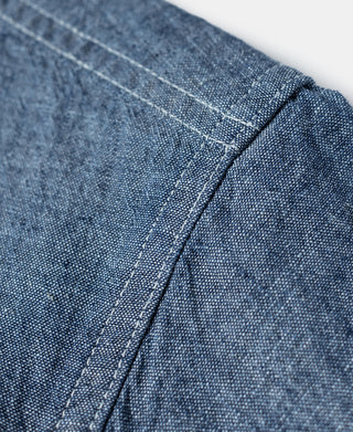 Blue chambray work shirt shoulder seam with stitched panel detail