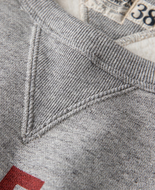Gray V-inset sweater stitching and neckline seam detail