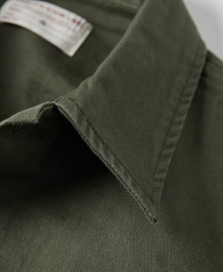 Olive fatigue utility shirt sleeve cuff with stitched placket and corner seam