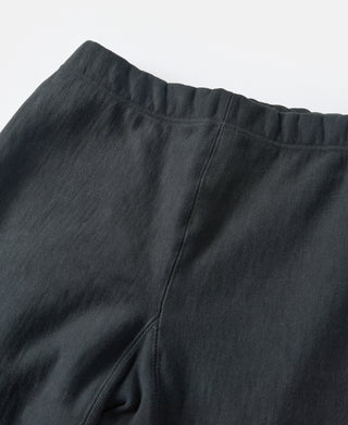 Black sweatpants with elastic waistband and stitched center seam