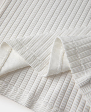 White ribbed knit T-shirt fabric with folded texture close-up