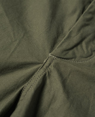 Olive pants seam detail with stitched hem and gathered fabric