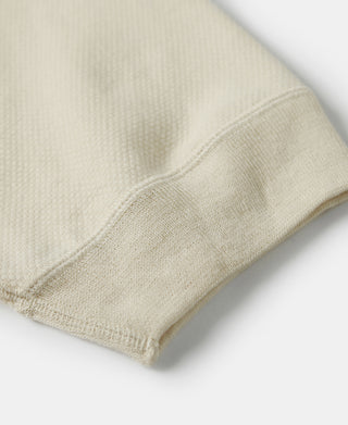 Light apricot waffle-knit T-shirt hem and cuff detail