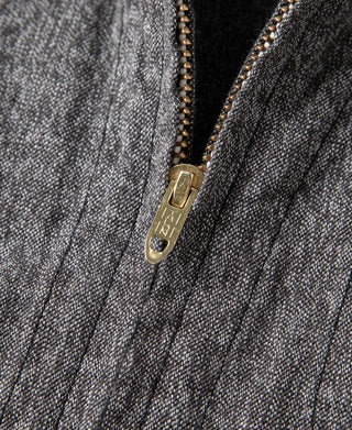 Salt & pepper cossack jacket close-up of gold zipper pull and placket stitching