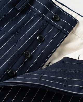 Navy pinstripe waistband with two dark buttons and stitched seams