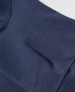 Navy T-shirt sleeve seam and short sleeve edge stitching; crew-neck collar