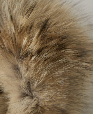Close-up of faux fur trim in light brown and cream tones