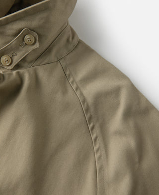Khaki trench coat with front button placket and side seam details