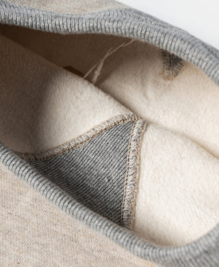 Oatmeal fleece sweatshirt interior with ribbed hem and stitched seam