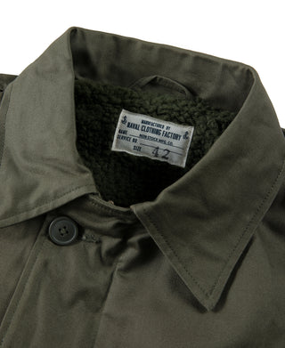 Olive deck jacket interior label and buttoned collar detail