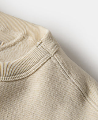 Cream sweatshirt neckline with ribbed collar and stitched V-inset seam