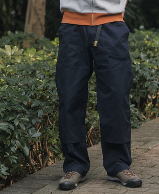Navy cotton canvas climbing pants with elastic waist and tapered leg opening