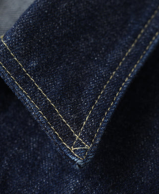 Indigo denim jacket triangular yoke seam detail with contrast stitching