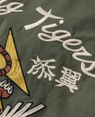 Olive embroidered white lettering detail and red lightning patch on flight jacket