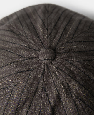 Close-up of dark gray yarn-dyed stripe crown with center button