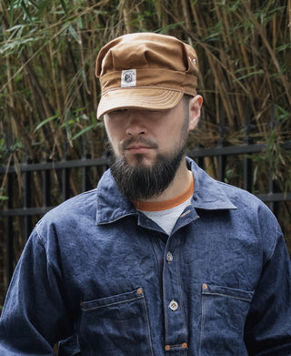 Ginger duck canvas engineer cap with curved brim and side patch, worn on head
