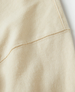 Apricot cotton T-shirt sleeve hem with double-stitched cuff seam