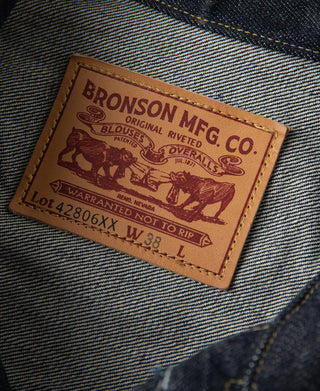 Indigo denim jacket care label on striped lining