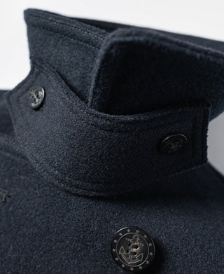 Navy peacoat close-up of raised collar and chest button