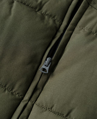 Olive quilted padded vest with metal zipper and stitched panel lines