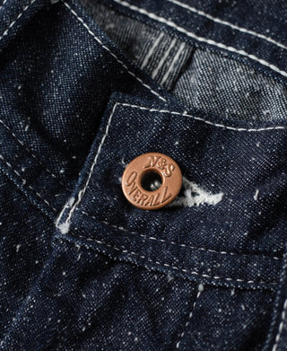 Indigo denim carpenter pants with bronze button and inner waistband stitching