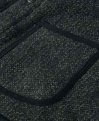 Flap pocket on dark salt-and-pepper wool vest