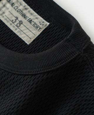 Black thermal waffle knit shirt detail with neck label and ribbed collar