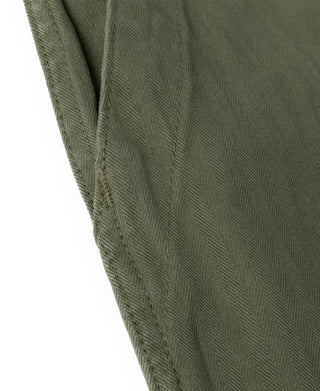 Olive fabric detail on fatigue pants with textured weave