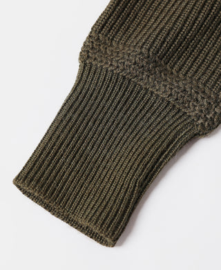 Olive ribbed knit sweater cuff with fold and tightly knit texture
