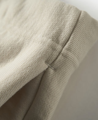 Apricot sweatpants side seam and terry texture detail