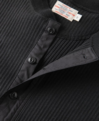 Black ribbed henley front detail with buttons and placket opening