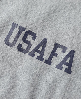 USAFA block letters on gray half-zip sweatshirt fabric