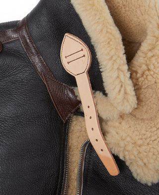 Shearling-lined front opening with brown leather zipper pull tab