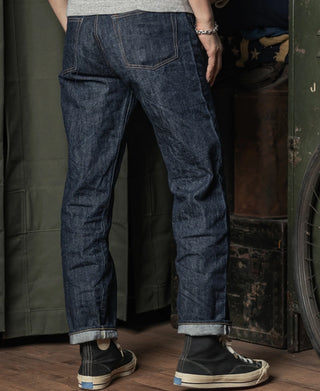 Dark blue denim jeans with back yoke and stitched hem cuffs