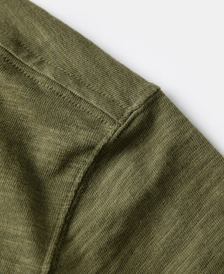 Green cotton T-shirt sleeve hem with stitched tubular gusset edge