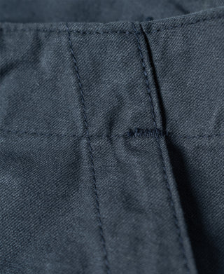 Navy shorts fabric close-up with inner seam and stitched panel construction