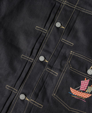 Black tour jacket placket with gold topstitching, snap buttons, and embroidered pocket