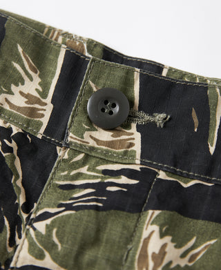 Tiger-camo shorts detail: large button closure at waist and stitched pocket